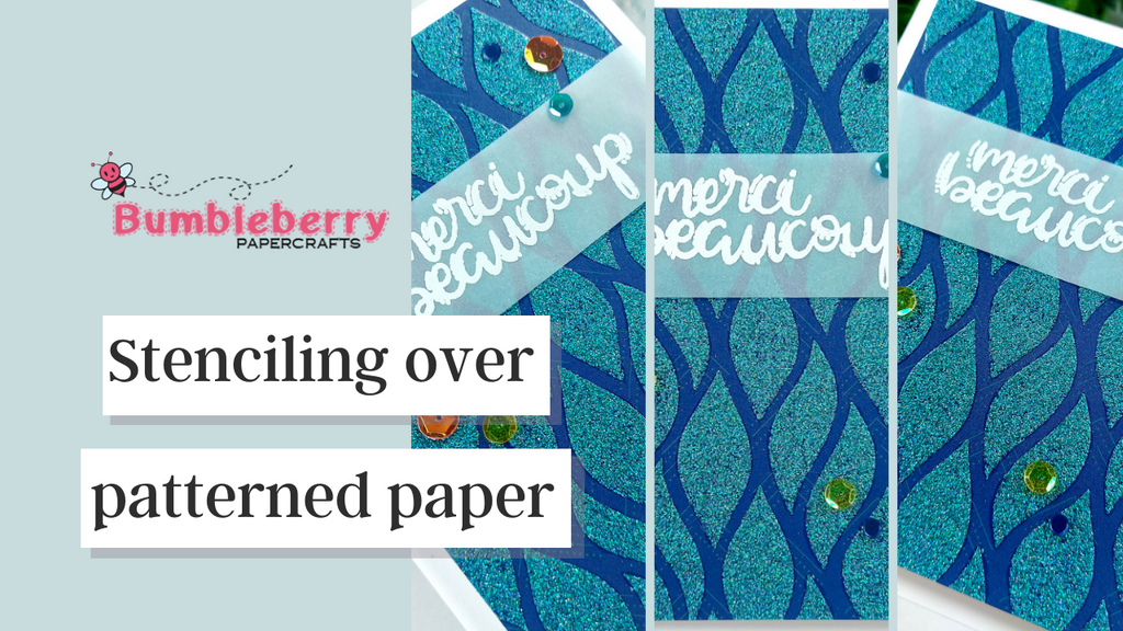 Stenciling over patterned paper - Catherine Pooler Global Adventures