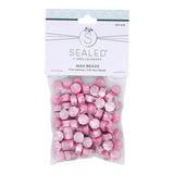 Perles de cire damassées roses de la collection Sealed by Spellbinders